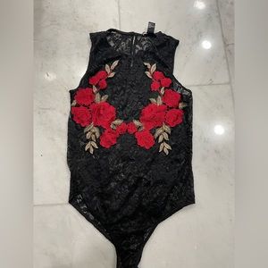 Forever 21, medium women’s bodysuit . Lace , gently worn